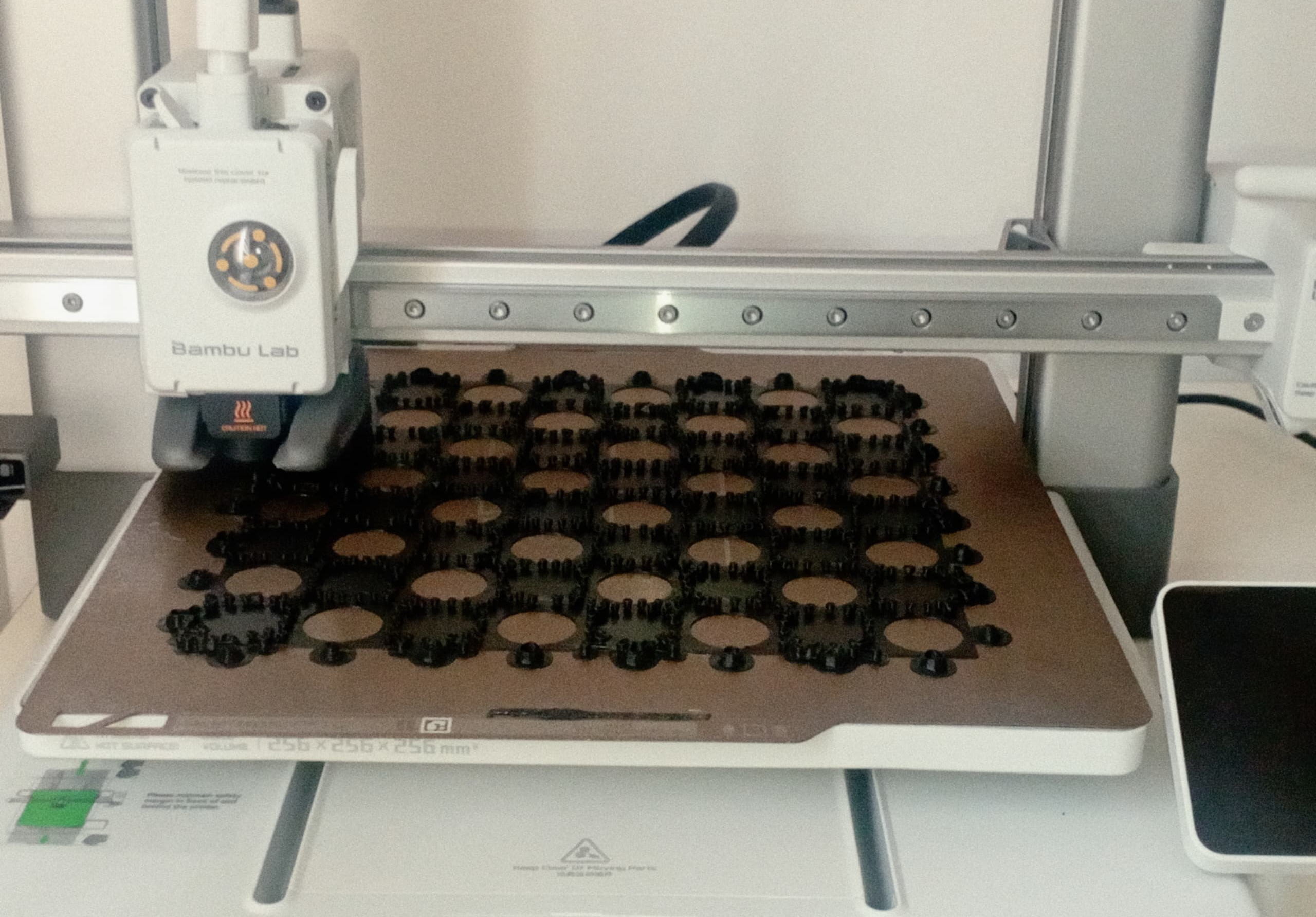 A picture of a chess board being printed on a 3D printer